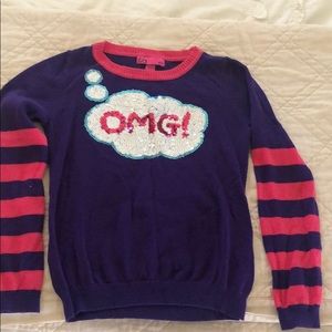 Sequined ‘OMG’ wornish sweater.
